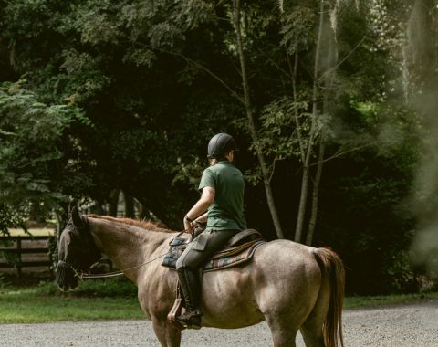 A guest on a horse at The Middleton Place Equestrian Center