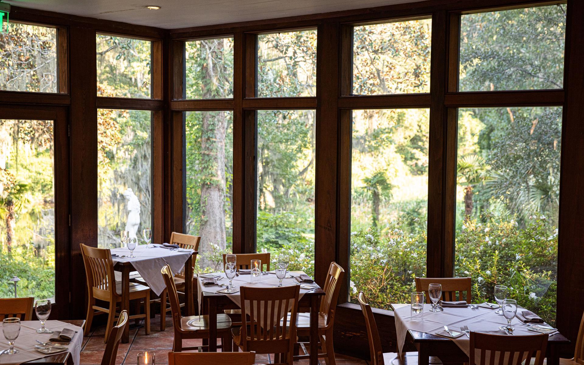 interior restaurant with tables and floor to ceiling windows