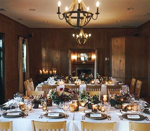 A room with large dining tables set up