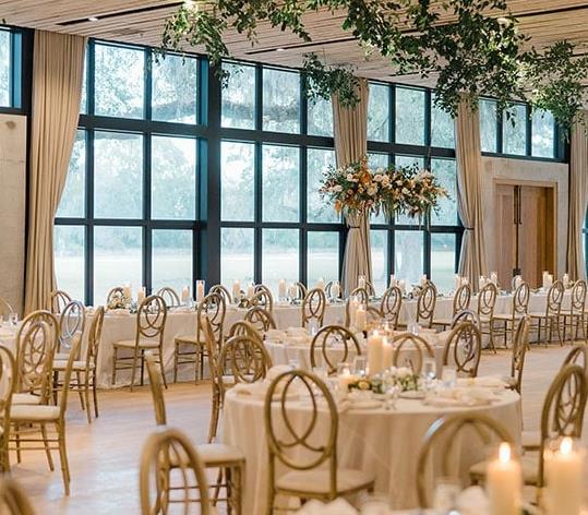 A ballroom with tables and chairs