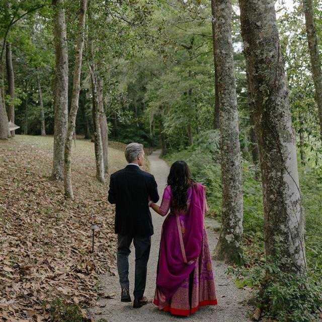 Two people walking down a path